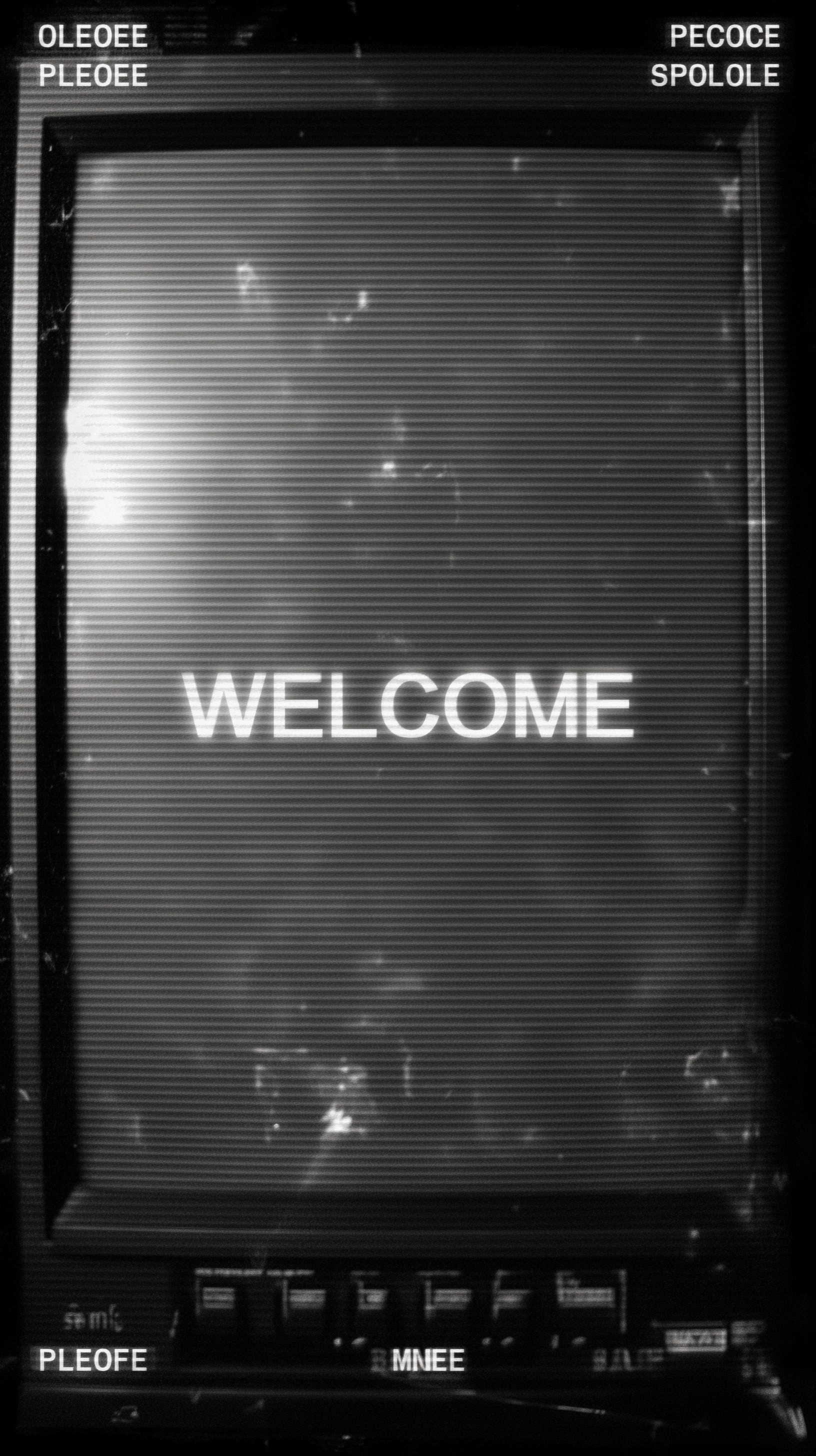 faded black background, multiple "WELCOME" texts i...